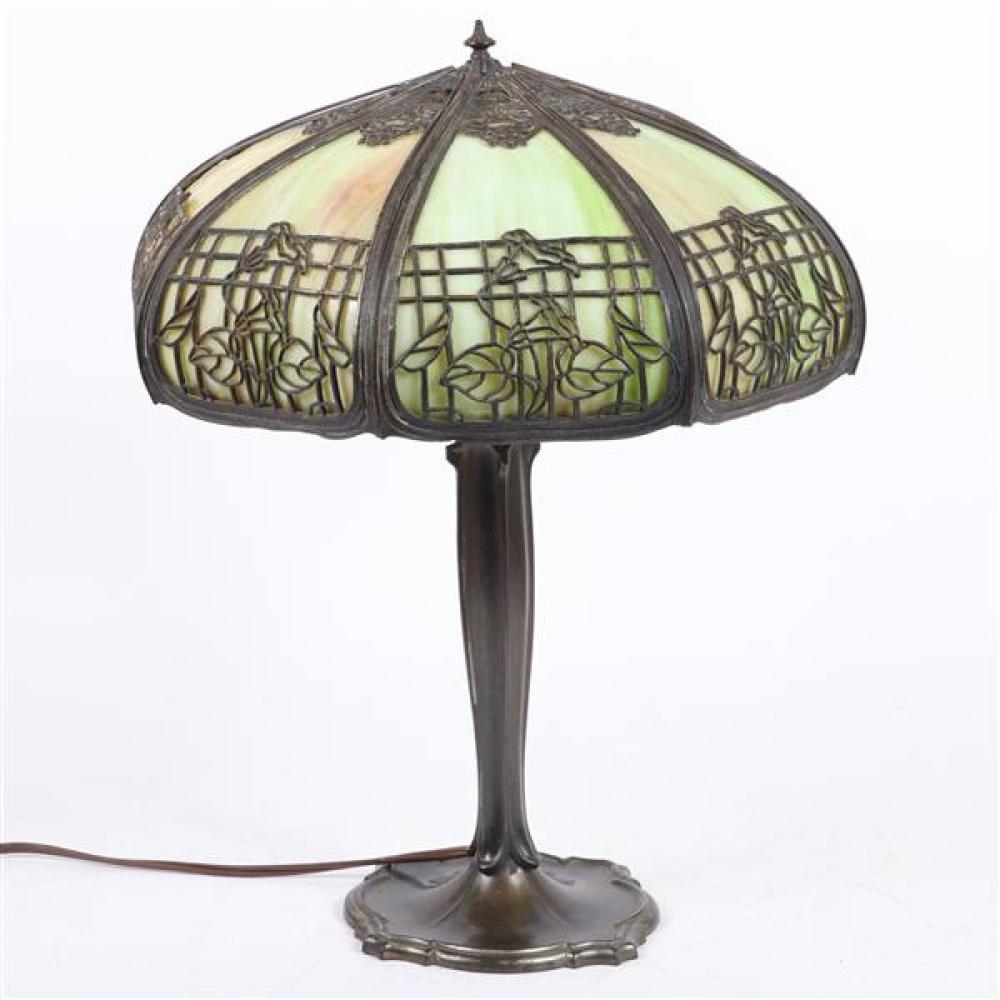 Appraisal: GREEN SLAG GLASS CURVED PANEL LAMP WITH OPENWORK METAL OVERLAY