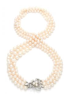 Appraisal: A MULTI-STRAND PEARL NECKLACE WITH DIAMOND CLASPThree strands ranging in