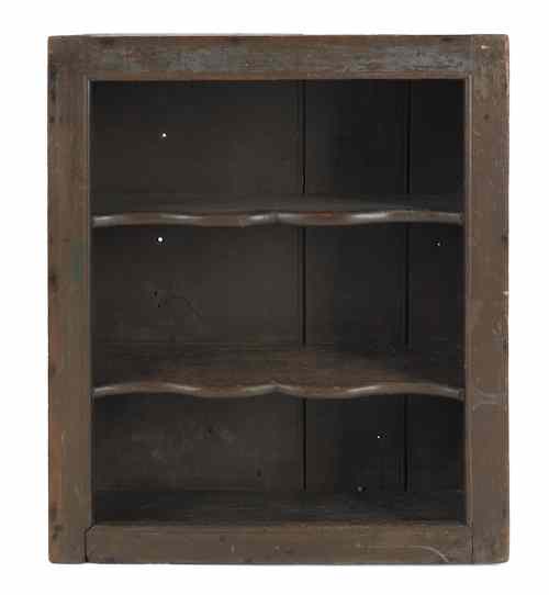 Appraisal: Pennsylvania poplar open wall cupboard ca retaining an old Spanish