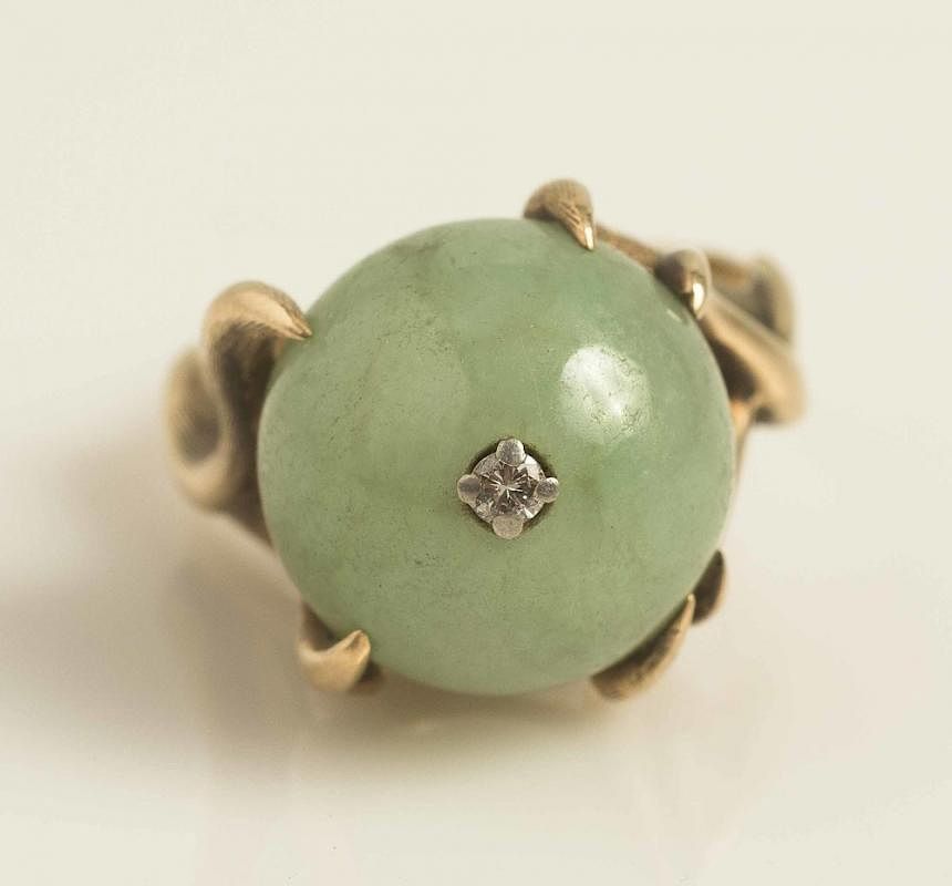 Appraisal: Jade k Ring Jade ring in k gold setting accented