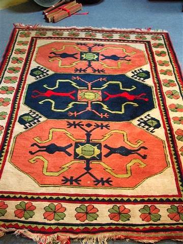 Appraisal: A PERSIAN RUG woven with three geometric octagons in colours