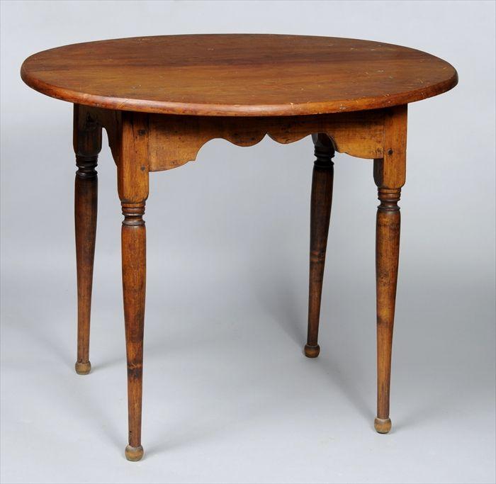 Appraisal: PINE AND MAPLE TAVERN TABLE The oval top over shaped