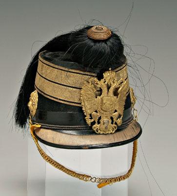 Appraisal: th century Shako helmet with chain lion head mounts below