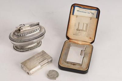 Appraisal: A Dunhill Elite cigarette lighter in an engine turned case