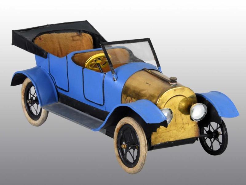 Appraisal: Tin Steam-Driven Automobile Toy Description Maker is unknown and toy