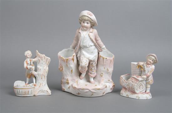 Appraisal: A Collection of Three Bisque Figural Match Strikes Height of