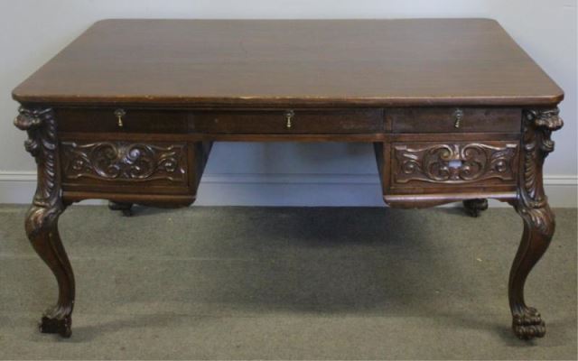 Appraisal: Victorian Mahogany Carved Desk Raised on ClawFeet Possibly Horner with