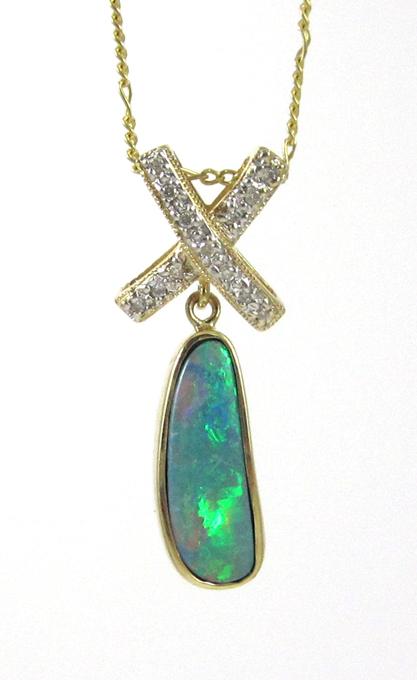 Appraisal: OPAL AND FOURTEEN KARAT GOLD PENDANT NECKLACE suspended on a