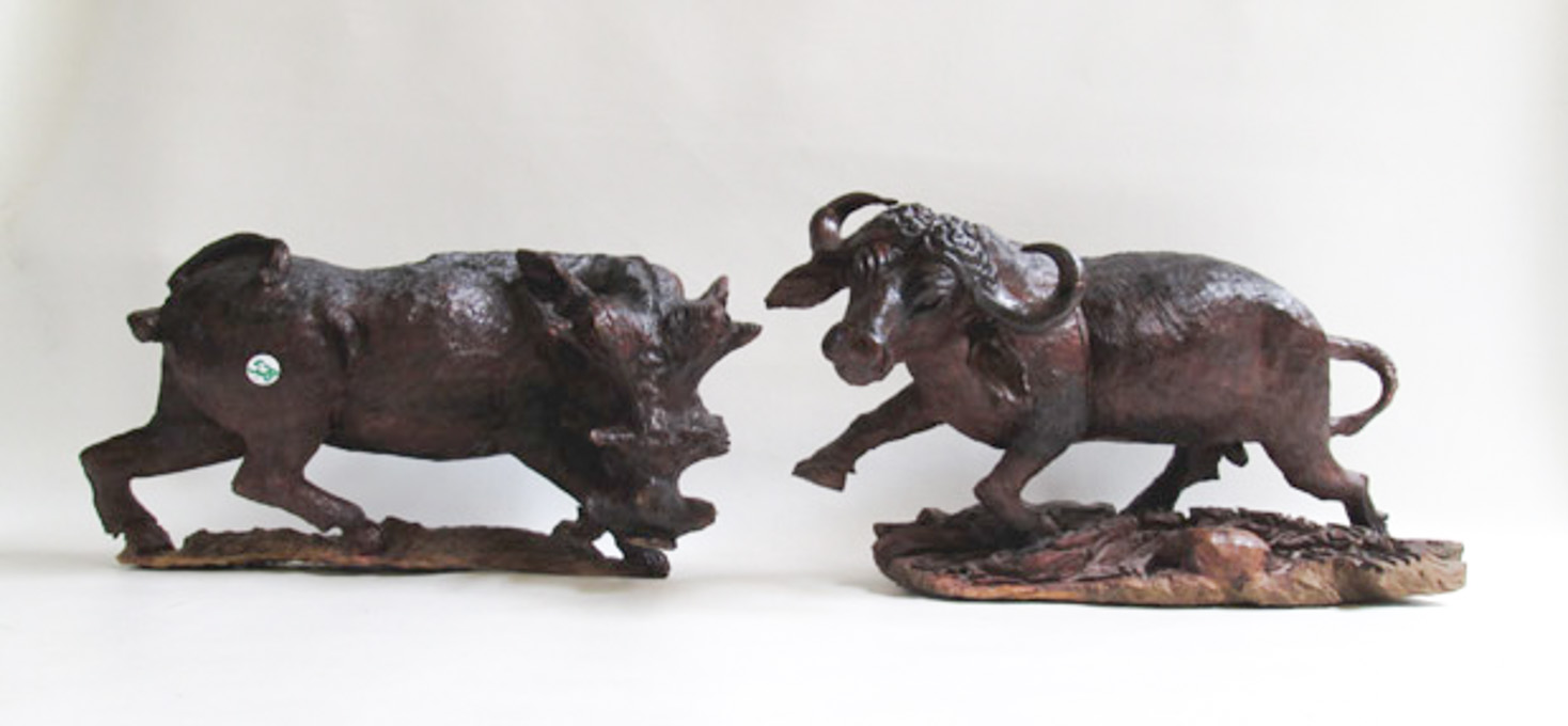 Appraisal: CARVED WOOD WATER BUFFALO AND WARTHOG heights from to inches