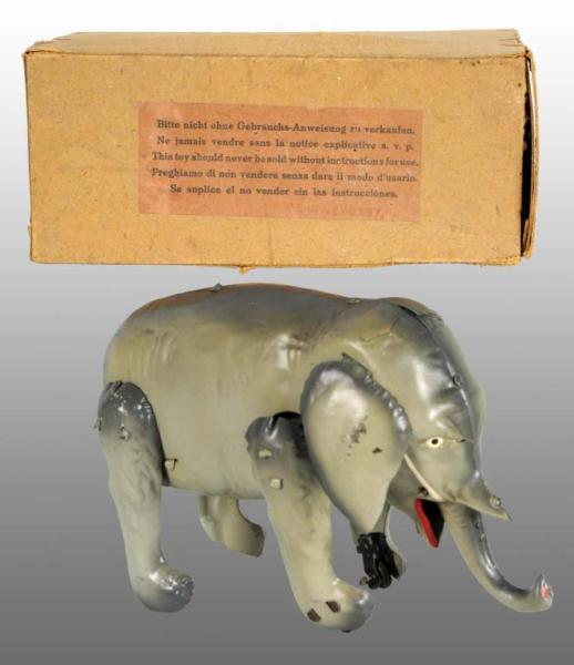 Appraisal: Tin Hand-Painted Elephant Wind-Up Toy Description German Working When wound