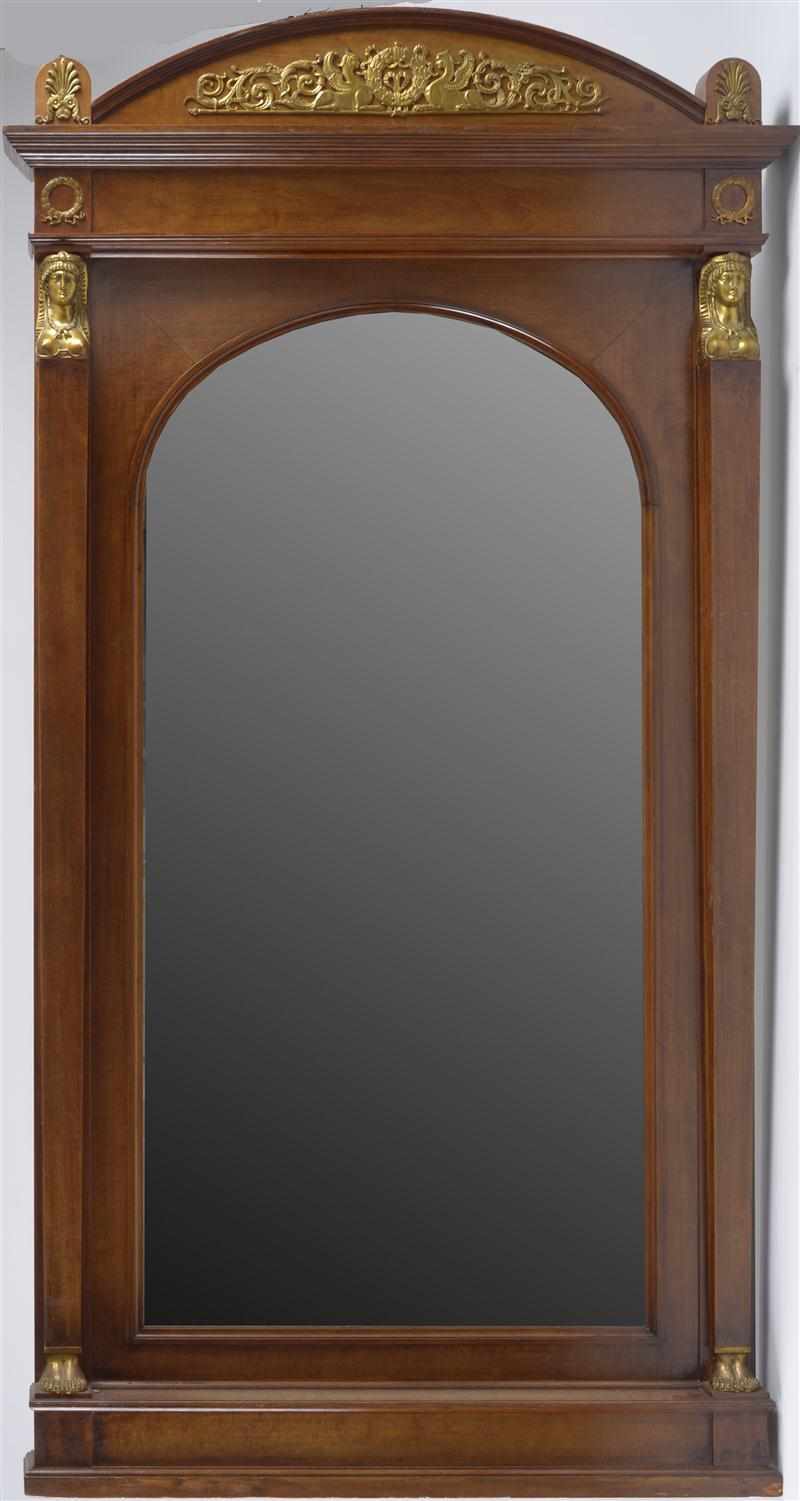 Appraisal: EMPIRE STYLE GILT-METAL MOUNTED MAHOGANY PIER MIRROR With arched beveled