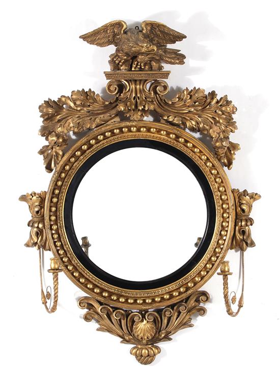 Appraisal: Regency carved giltwood girandole mirror early th century eagle and