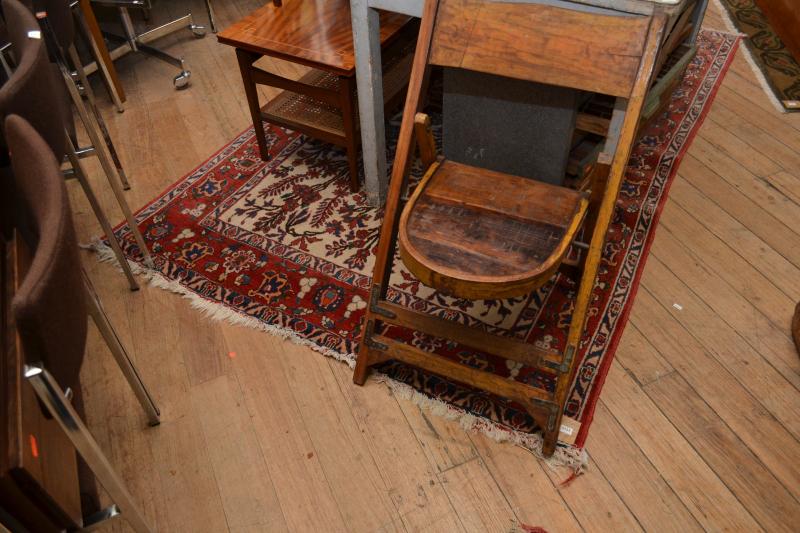 Appraisal: A PERSIAN STYLE FLOOR RUG IN CREAM GROUND AND ALL-OVER