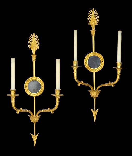 Appraisal: A pair of Empire style gilt bronze two light bras