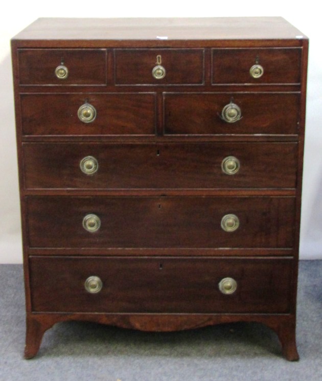 Appraisal: A George III mahogany secretaire chest the fitted drawer over