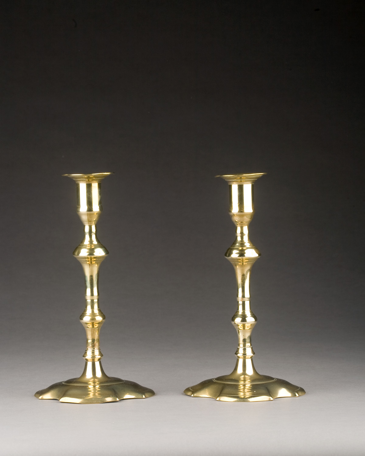 Appraisal: PAIR OF GEORGE II BRASS CANDLESTICKS CIRCA - Each tapered