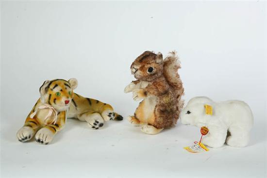 Appraisal: THREE STUFFED ANIMALS Steiff squirrel with button and partial tag