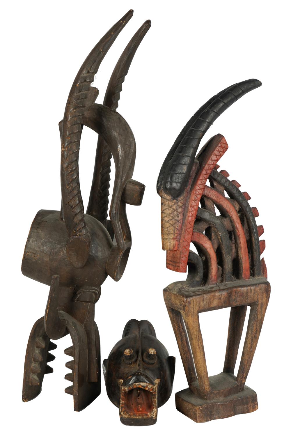 Appraisal: THREE AFRICAN-PAINTED WOOD CARVINGScomprising a mask inches wide inches deep