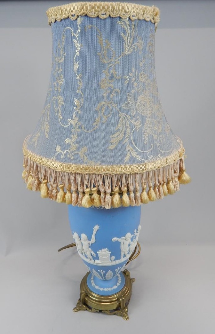 Appraisal: A Wedgwood blue Jasperware lamp base decorated with putti on