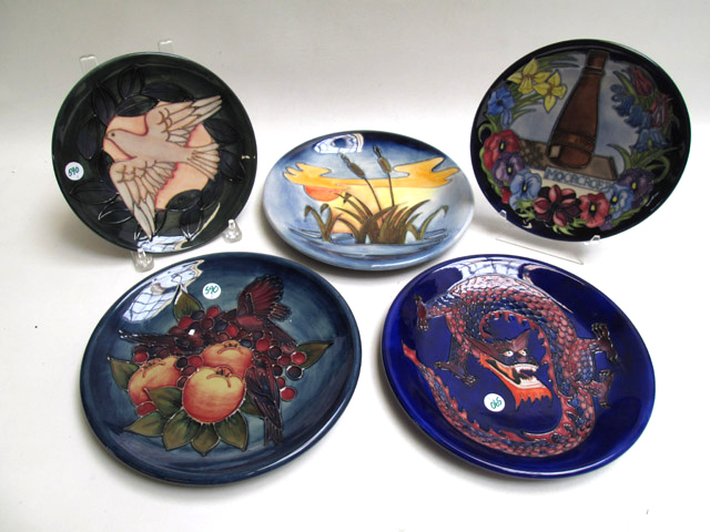 Appraisal: FIVE MOORCROFT POTTERY PLATES hand painted underglaze with assorted patterns