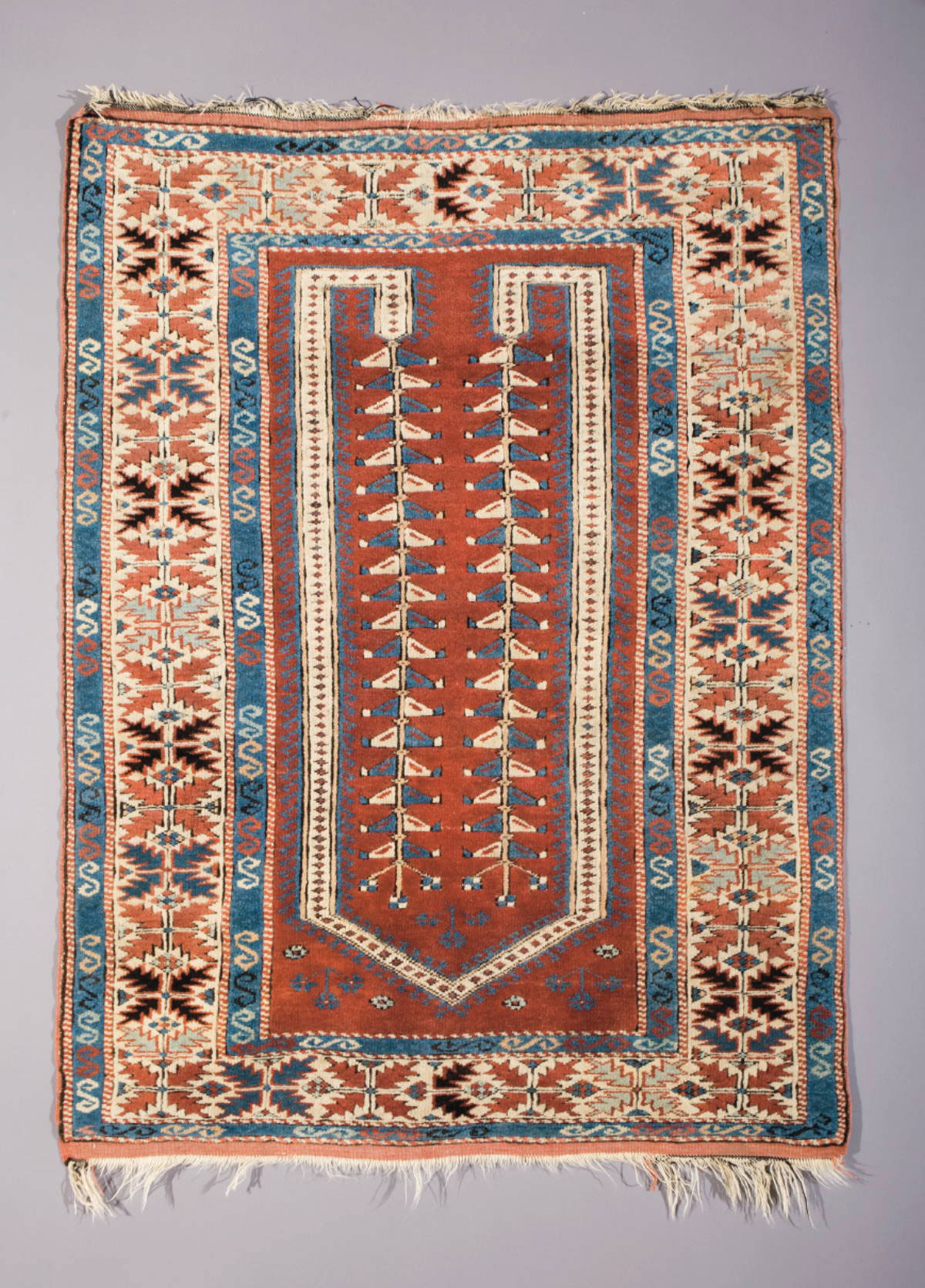 Appraisal: WEST ANATOLIAN PRAYER RUG CIRCA The tomato red field with