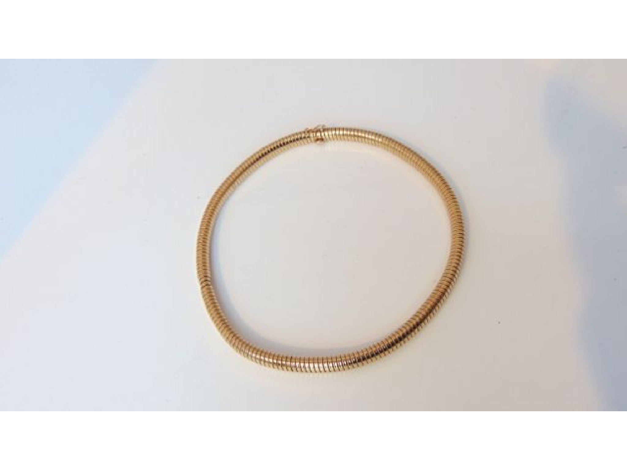 Appraisal: A ct gold flexi snake link necklace g