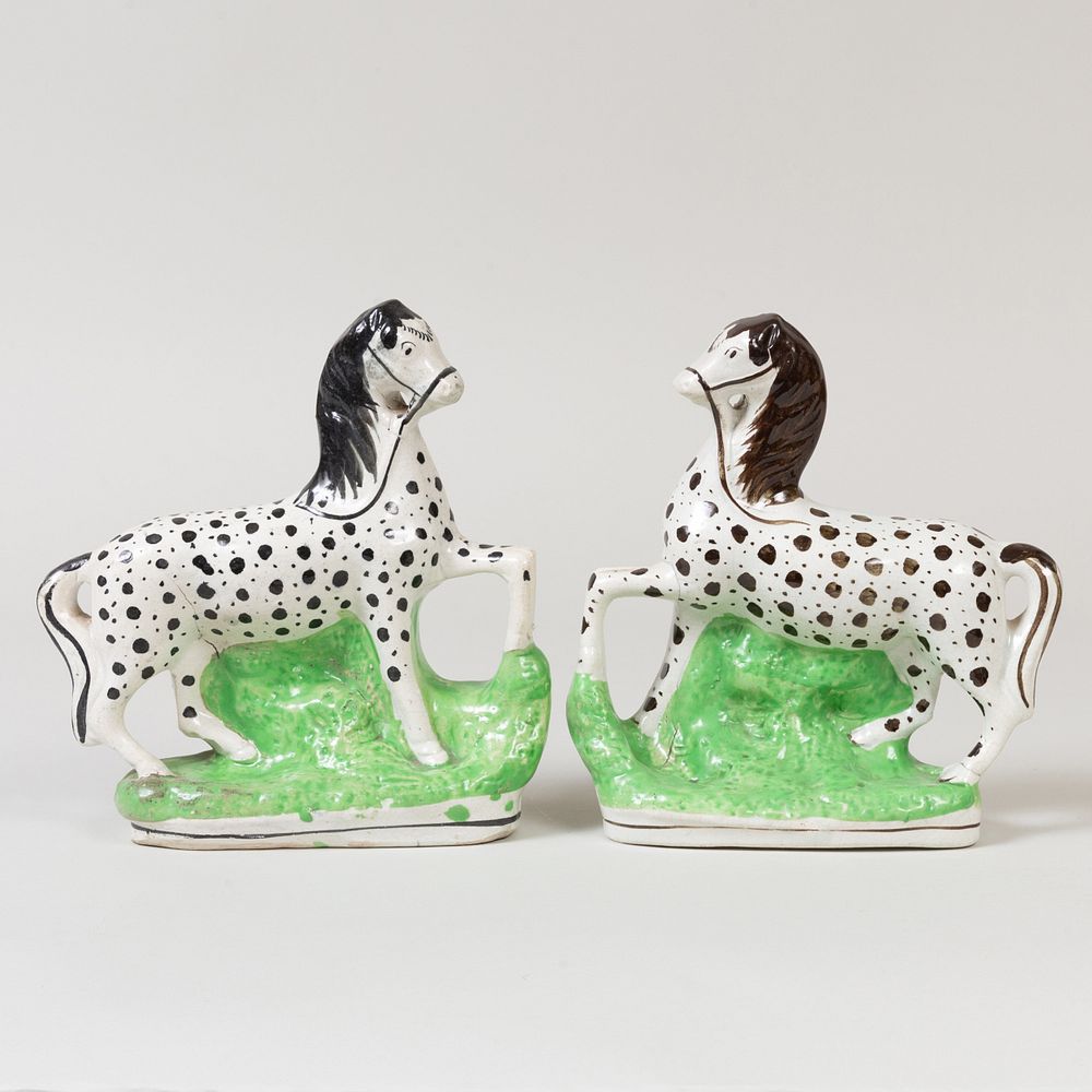 Appraisal: Pair of Staffordshire Pottery Models of Horses in high Property