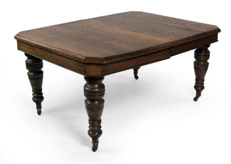 Appraisal: A Victorian oak extending dining table the moulded rectangular top