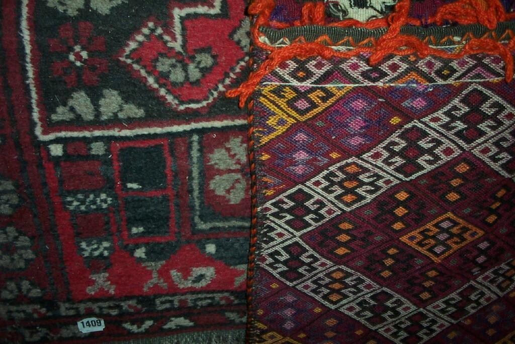 Appraisal: Two small Persian wool rugs with red ground together with