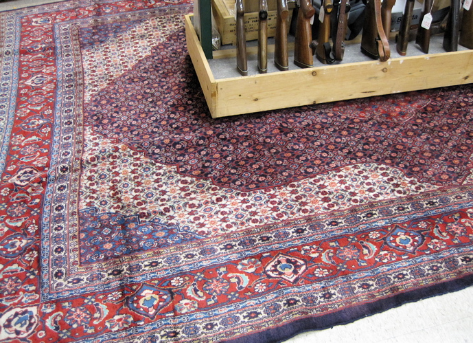 Appraisal: PERSIAN CARPET overall Herati floral design on red medallion blue