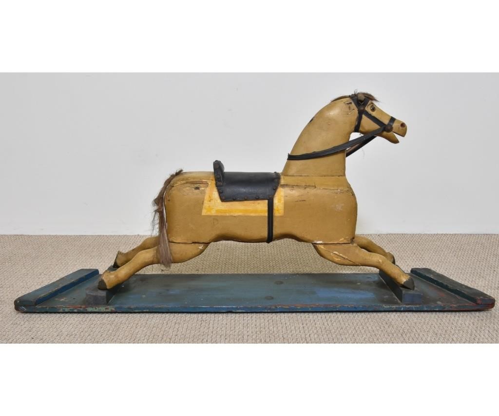 Appraisal: Carved wood rocking horse with glass eyes and leather saddle