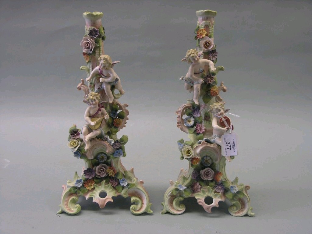 Appraisal: A pair of late th century continental porcelain figural candelabra