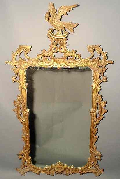 Appraisal: Chippendale style ornately carved mirror with gilt decoration and phoenix