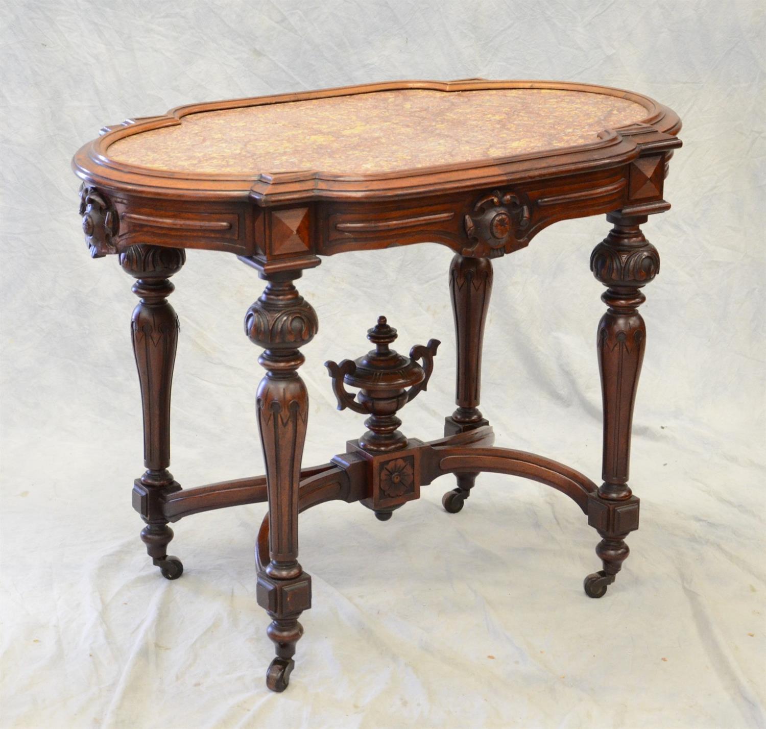 Appraisal: Carved walnut Renaissance Revival Victorian turtle shaped brown marble top