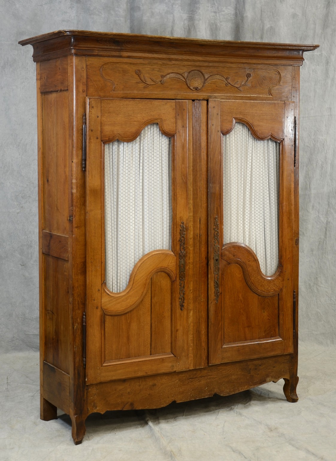 Appraisal: Oak French Provincial two door armoire each door fitted with