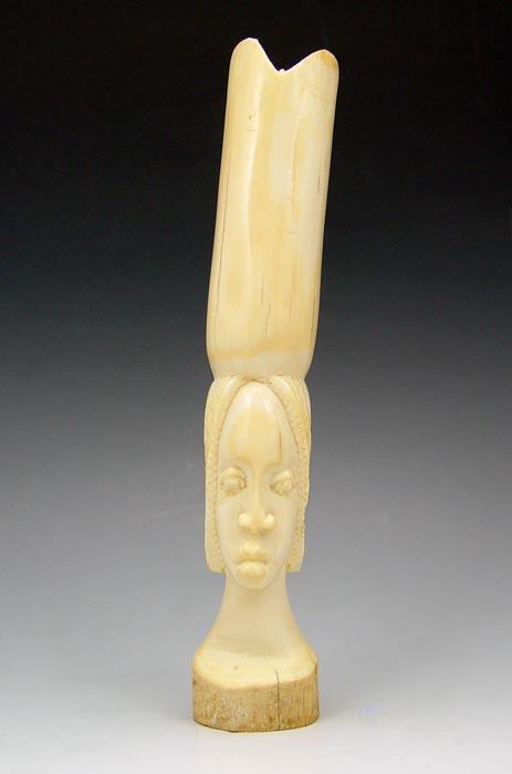 Appraisal: AFRICAN CARVED IVORY Carved from a single tusk '' length