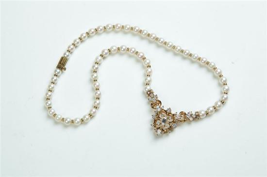 Appraisal: PEARL AND DIAMOND NECKLACE Twentieth century unmarked K gold mounting