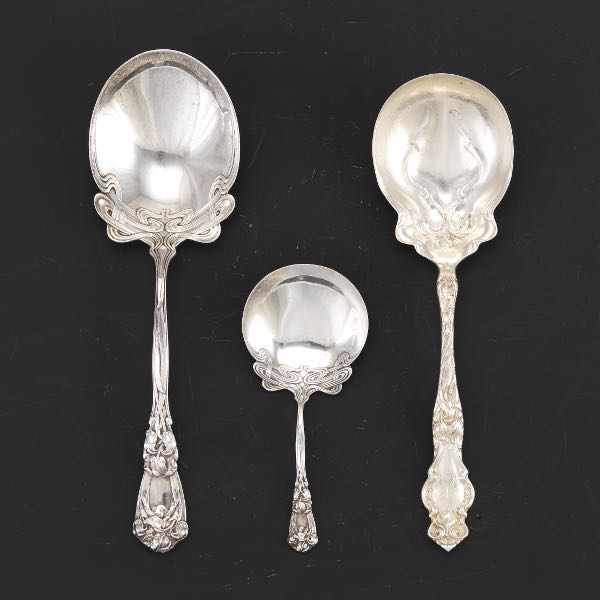 Appraisal: THREE STERLING SILVER SERVING SPOONS William B Durgin Iris pattern