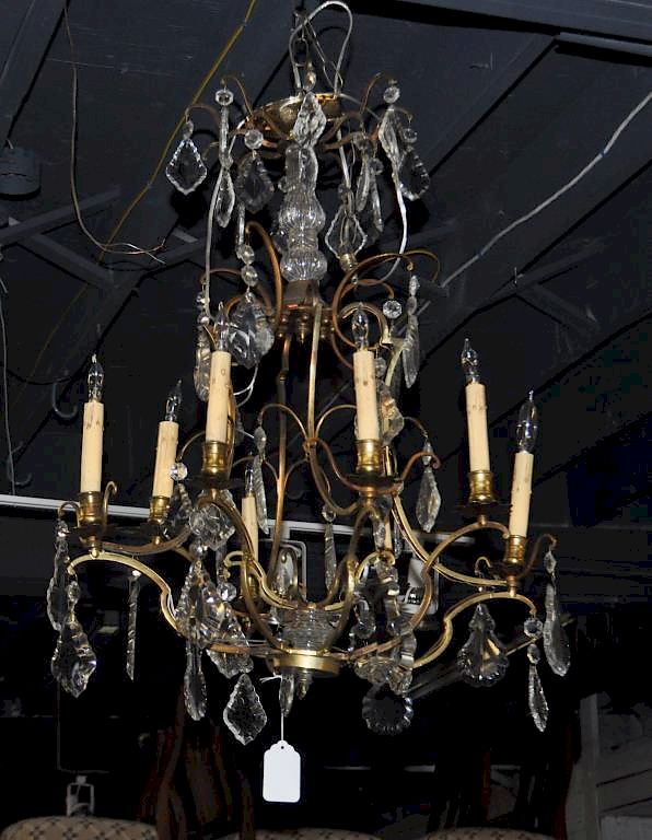 Appraisal: Regency Brass Crystal Scrolled Chandelier eight light with shaped candle