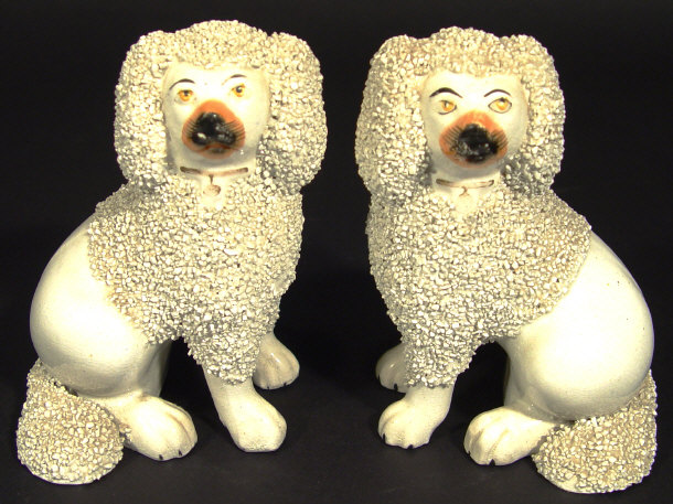 Appraisal: Pair of Victorian Staffordshire poodles each with separate front feet