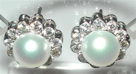 Appraisal: A pair of cultured pearl and diamond earrings each composed