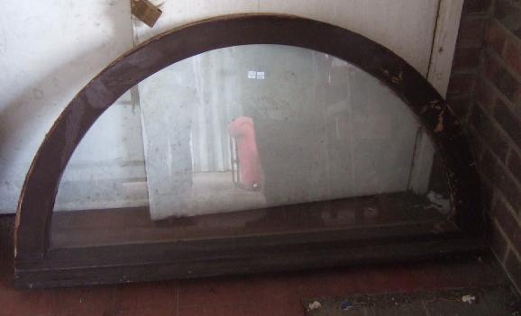 Appraisal: A pair of framed semi circular windows cm wide x