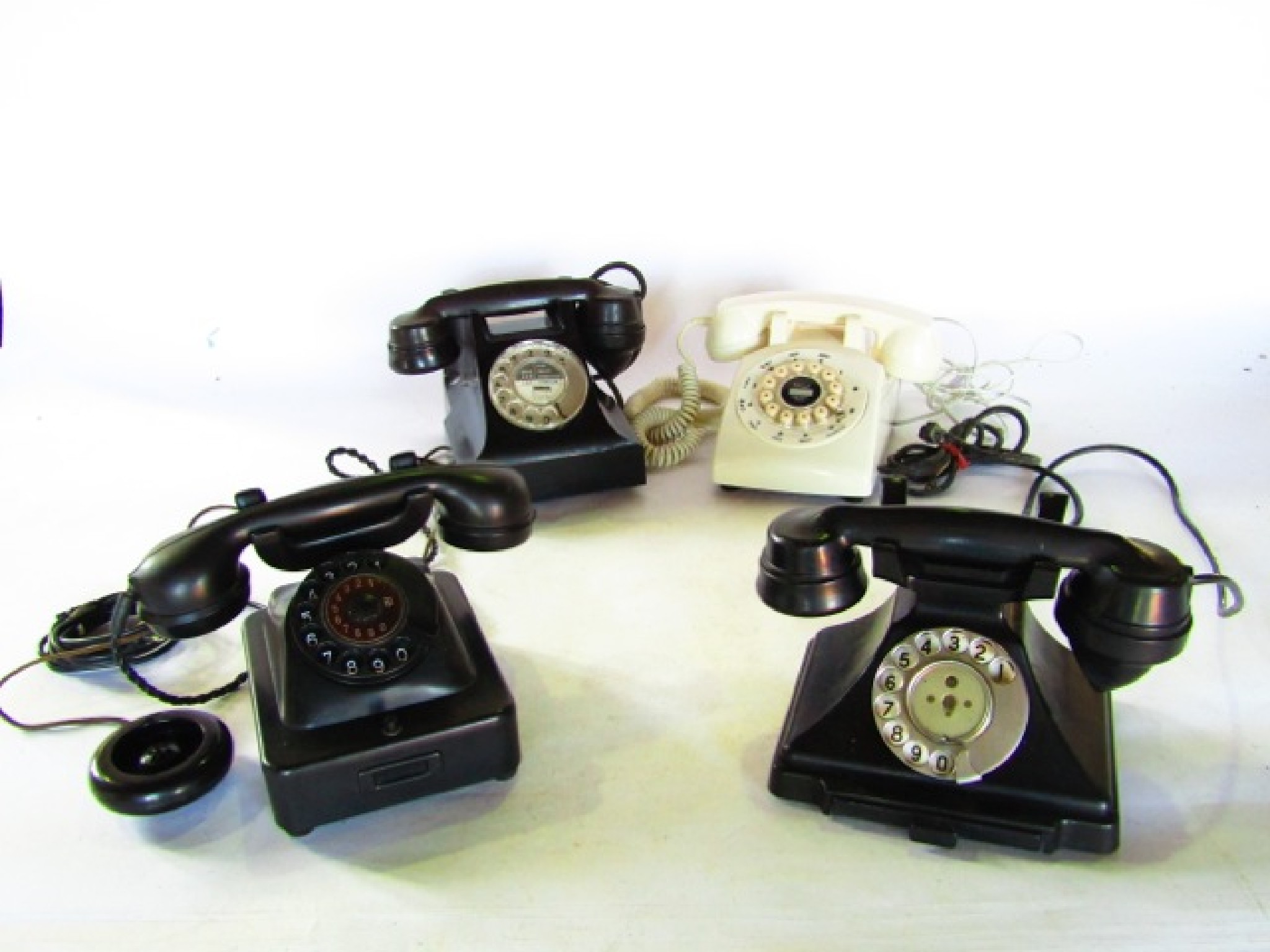 Appraisal: th century telephones to include three black Bakelite cased examples