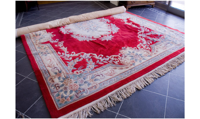 Appraisal: Large Chinese Woolen Rug Floral Decoration On A Deep Red