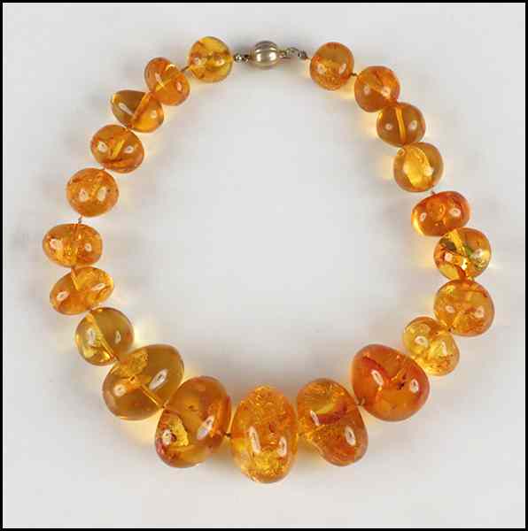 Appraisal: POLISH AMBER NECKLACE Graduated amber bears are mm - mm