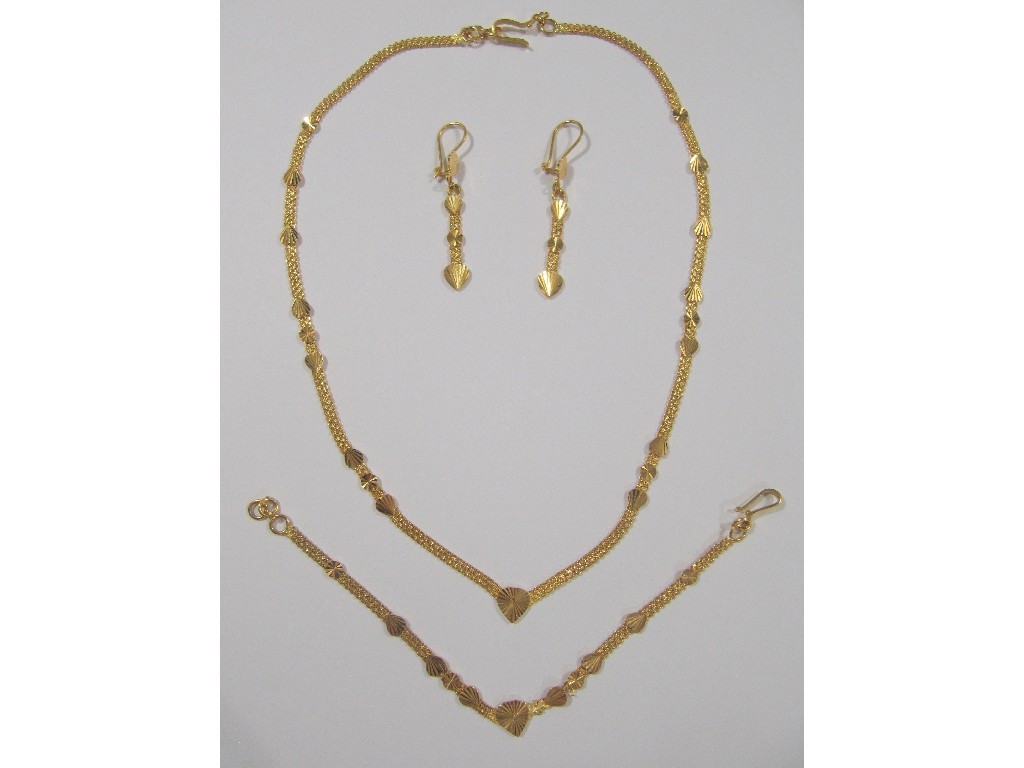 Appraisal: Twenty two carat gold weave link necklace with applied heart