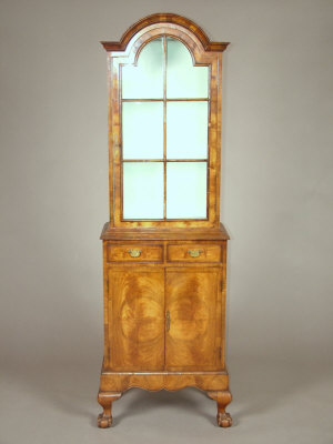 Appraisal: A walnut Queen Anne style side cabinet the dome moulded