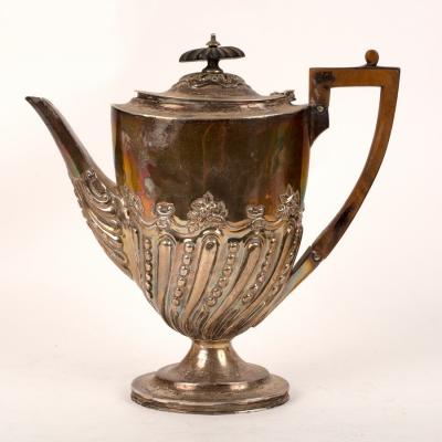 Appraisal: A Victorian silver coffee pot London with hinged cover and