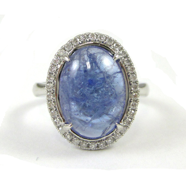 Appraisal: TANZANITE AND FOURTEEN KARAT WHITE GOLD RING with round-cut diamonds