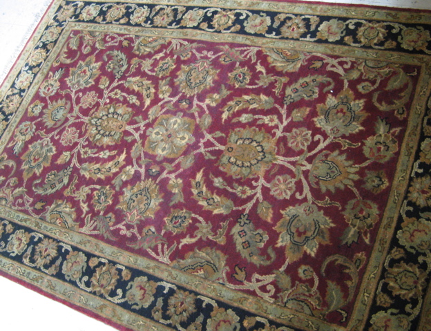 Appraisal: HAND KNOTTED ORIENTAL AREA RUG Indo-Persian overall floral design on